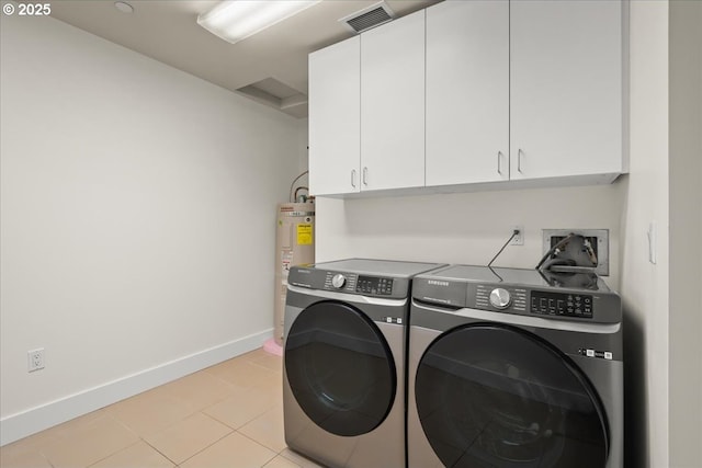 laundry room featuring cabinets, separate washer and dryer, light tile patterned floors, and water heater