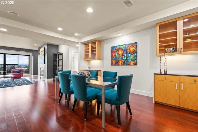 dining area featuring dark hardwood / wood-style floors