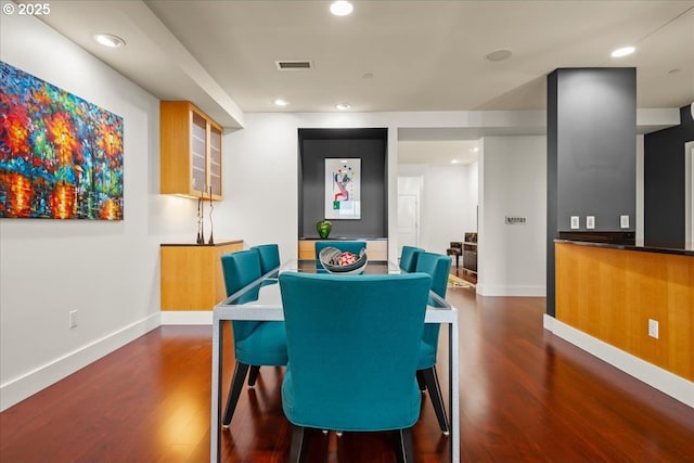 dining space featuring dark hardwood / wood-style floors