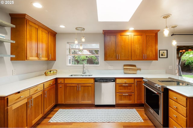 kitchen with stainless steel appliances, a sink, open shelves, light wood finished floors, and light countertops