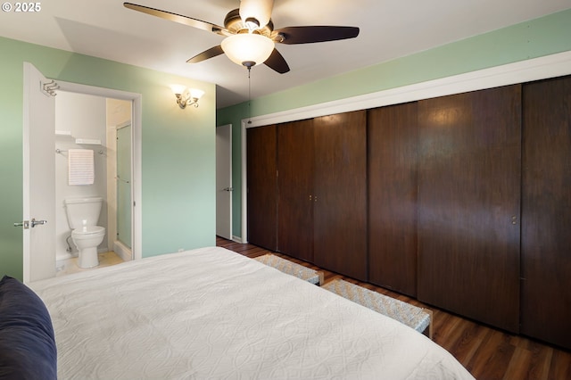 bedroom with a closet, wood finished floors, a ceiling fan, and ensuite bathroom