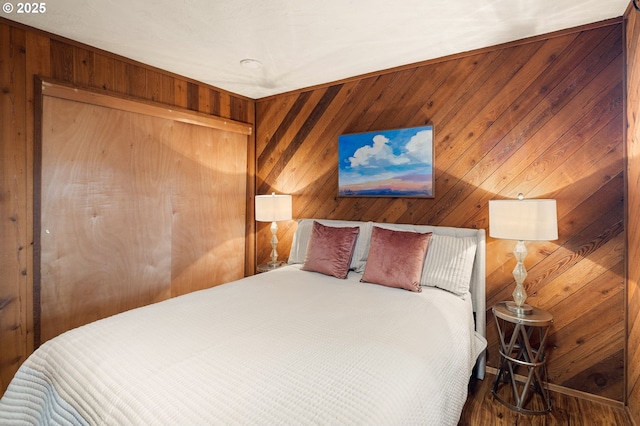 bedroom with wooden walls