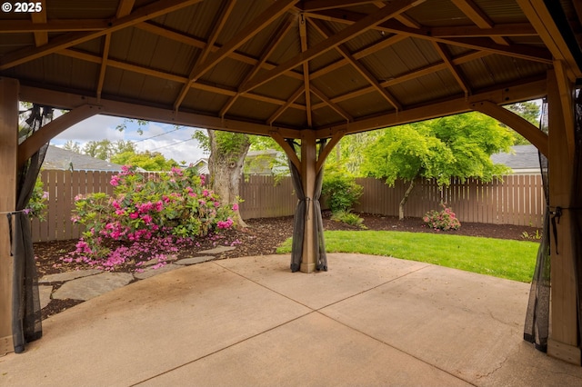 view of patio featuring a gazebo and a fenced backyard