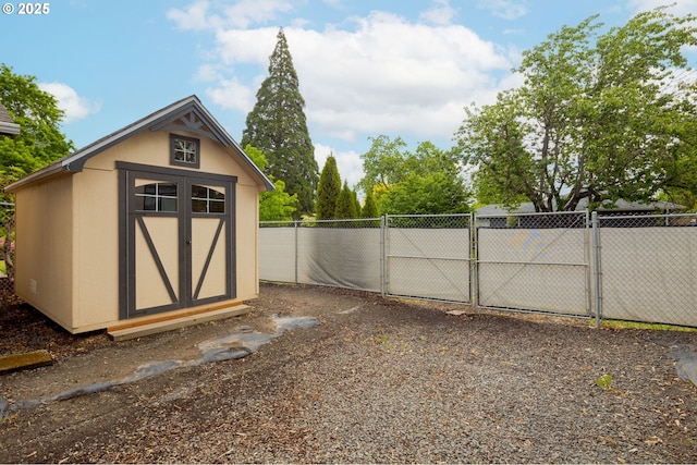 view of shed with a gate and fence