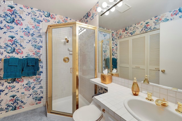 bathroom featuring a shower stall, wallpapered walls, toilet, and a sink