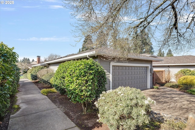 view of property exterior featuring a garage