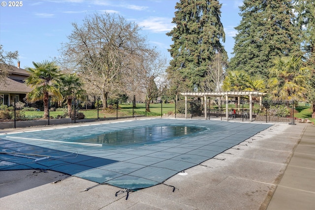 view of pool with a patio area, fence, a covered pool, and a pergola