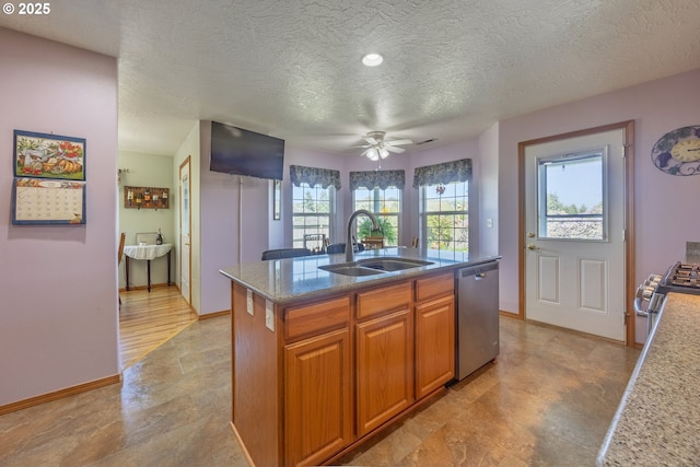 788 SE Meadows Loop, Sheridan, OR 97378 - kitchen with a textured ceiling, a healthy amount of sunlight, appliances with stainless steel finishes, and a sink
