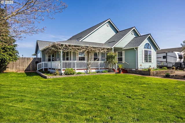 788 SE Meadows Loop, Sheridan, OR 97378 - view of front of house with fence, a front lawn, and covered porch