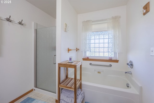 788 SE Meadows Loop, Sheridan, OR 97378 - bathroom with a bath, baseboards, and a stall shower