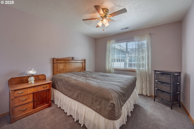 788 SE Meadows Loop, Sheridan, OR 97378 - carpeted bedroom featuring ceiling fan, baseboards, a textured ceiling, and visible vents