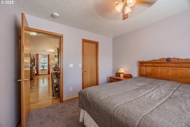 788 SE Meadows Loop, Sheridan, OR 97378 - bedroom featuring a ceiling fan, carpet, and a textured ceiling
