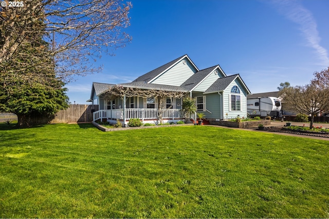 788 SE Meadows Loop, Sheridan, OR 97378 - view of front facade with fence, a porch, and a front yard