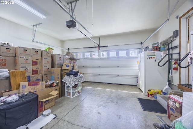 788 SE Meadows Loop, Sheridan, OR 97378 - garage featuring freestanding refrigerator and a garage door opener