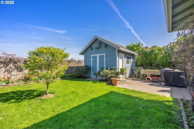 788 SE Meadows Loop, Sheridan, OR 97378 - rear view of house with fence, a lawn, an outbuilding, and a patio