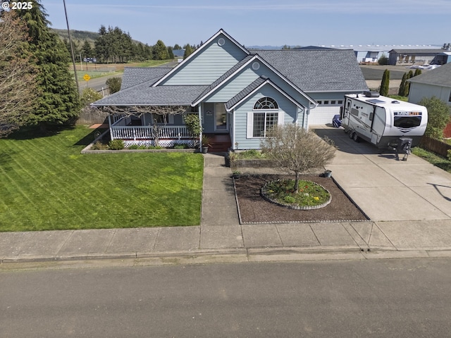 788 SE Meadows Loop, Sheridan, OR 97378 - view of front of home with a shingled roof, a front lawn, covered porch, and concrete driveway