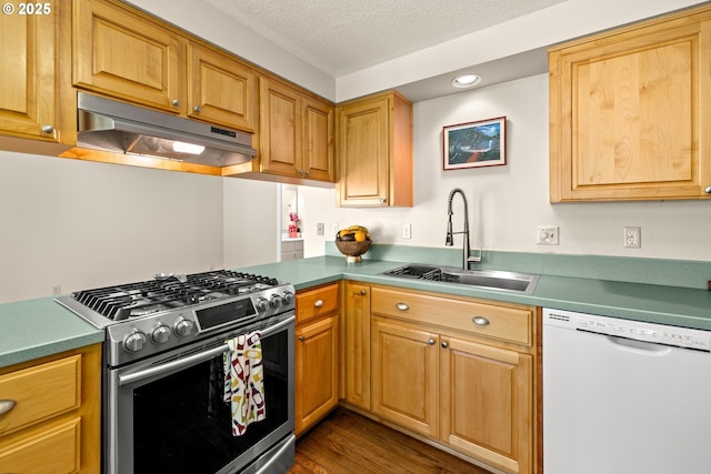 5877 NW 181st Ave, Portland, OR 97229 - kitchen featuring dishwasher, stainless steel gas range oven, under cabinet range hood, dark wood finished floors, and a textured ceiling