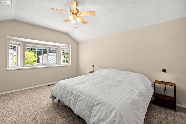5877 NW 181st Ave, Portland, OR 97229 - carpeted bedroom featuring lofted ceiling, a textured ceiling, and a ceiling fan