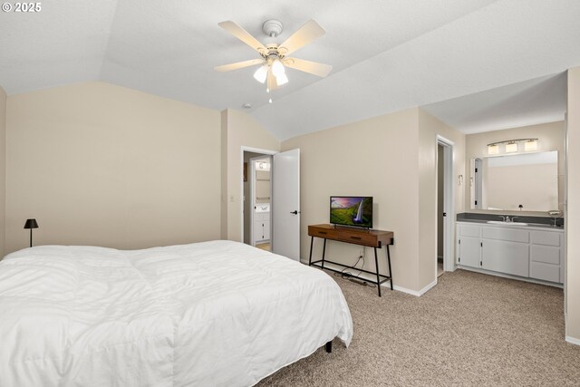 5877 NW 181st Ave, Portland, OR 97229 - bedroom with lofted ceiling, light carpet, ensuite bath, and a ceiling fan