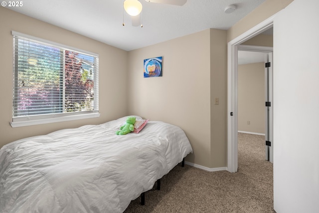 5877 NW 181st Ave, Portland, OR 97229 - carpeted bedroom with baseboards and ceiling fan