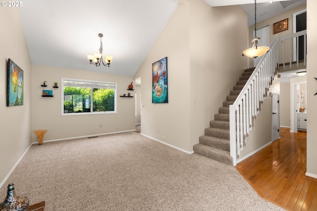 5877 NW 181st Ave, Portland, OR 97229 - interior space featuring a chandelier, stairs, high vaulted ceiling, and hardwood / wood-style floors