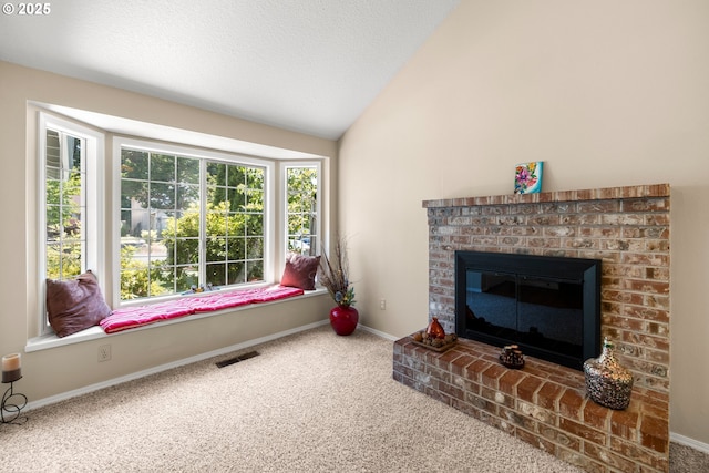 5877 NW 181st Ave, Portland, OR 97229 - living room with carpet, vaulted ceiling, and a fireplace