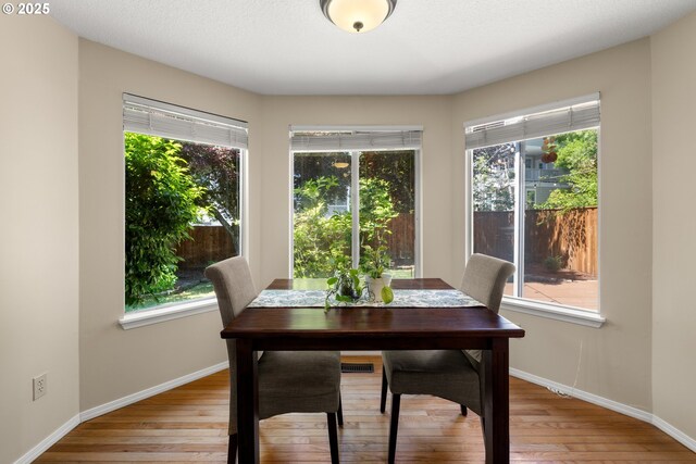 5877 NW 181st Ave, Portland, OR 97229 - dining room with healthy amount of natural light and light wood finished floors
