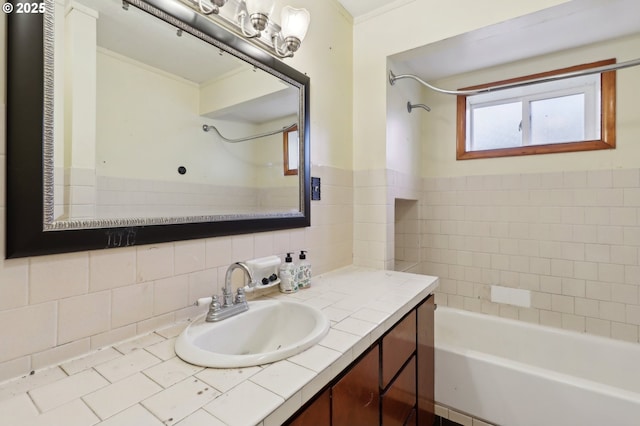 bathroom featuring vanity and tiled shower / bath