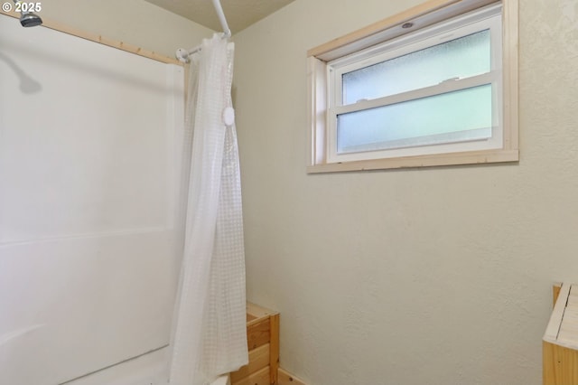 bathroom with a shower with shower curtain