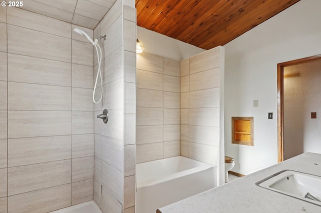 bathroom featuring a tile shower, vanity, wood ceiling, and toilet