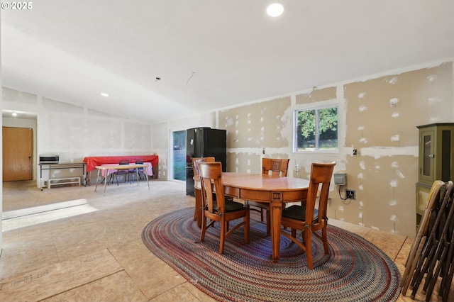 dining area with lofted ceiling