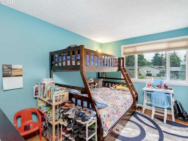 bedroom with wood-type flooring