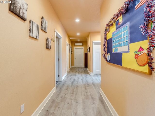 hall with light hardwood / wood-style flooring