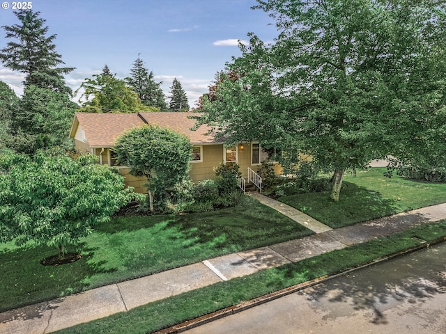 1220 NE 196th Ave, Portland, OR 97230 - obstructed view of property featuring a front lawn and a shingled roof
