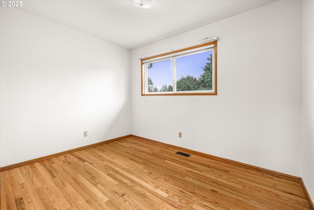 1220 NE 196th Ave, Portland, OR 97230 - empty room featuring light wood-style floors and baseboards
