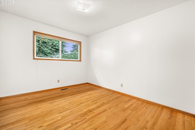 1220 NE 196th Ave, Portland, OR 97230 - spare room with wood finished floors and baseboards