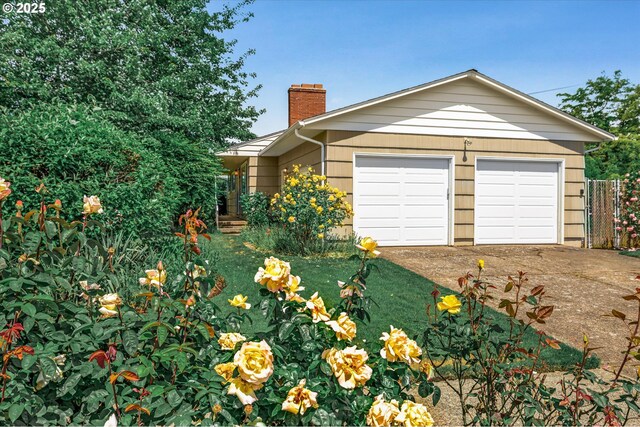 1220 NE 196th Ave, Portland, OR 97230 - view of front facade with a chimney and a garage