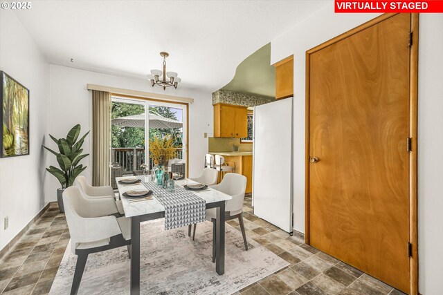 1220 NE 196th Ave, Portland, OR 97230 - dining area with a chandelier and stone finish floors