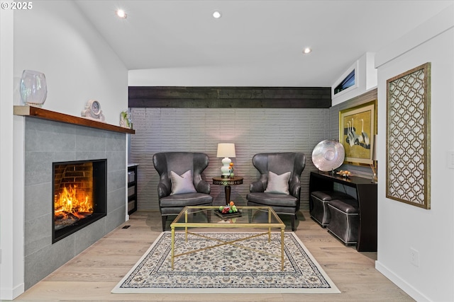 1801 NW Walmer Dr, Portland, OR 97229 - living area with light wood-type flooring, recessed lighting, a tiled fireplace, and an accent wall