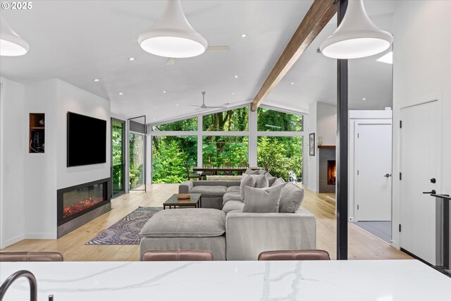 1801 NW Walmer Dr, Portland, OR 97229 - living room with a glass covered fireplace, ceiling fan, light wood-style flooring, and recessed lighting