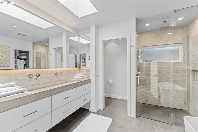 1801 NW Walmer Dr, Portland, OR 97229 - full bath featuring a skylight, vanity, a shower stall, a walk in closet, and recessed lighting