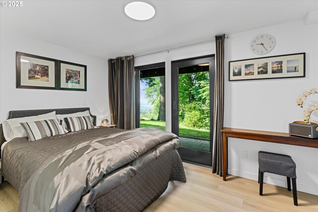 1801 NW Walmer Dr, Portland, OR 97229 - bedroom with light wood-type flooring and access to outside