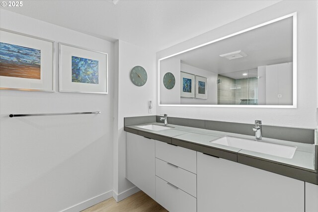 1801 NW Walmer Dr, Portland, OR 97229 - bathroom with double vanity, tiled shower, and wood finished floors