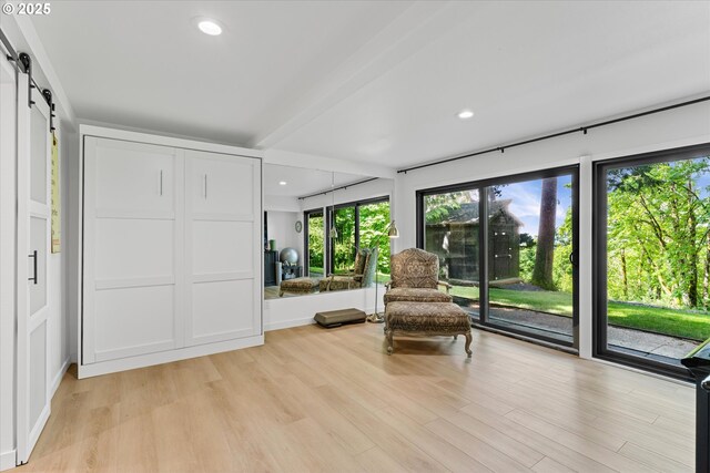 1801 NW Walmer Dr, Portland, OR 97229 - living area with a barn door, light wood-style flooring, and recessed lighting