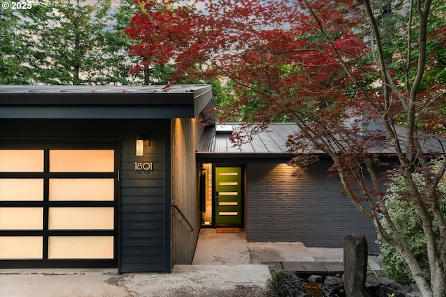 1801 NW Walmer Dr, Portland, OR 97229 - entrance to property with an attached garage and a metal roof