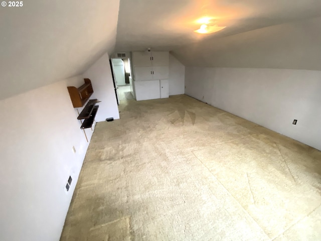 bonus room featuring carpet and lofted ceiling