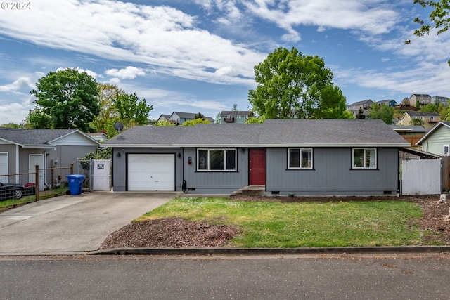 single story home with a garage and a front yard