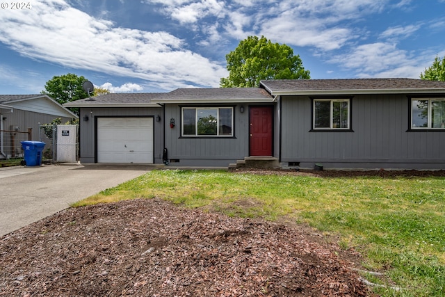 ranch-style house with a front yard and a garage