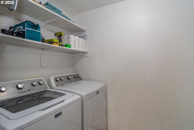 washroom with washer and dryer