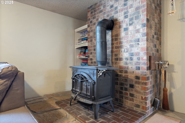 details with a wood stove and a textured ceiling